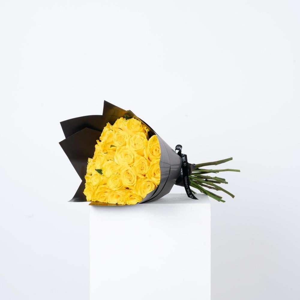 Yellow rose bouquet with black wrapping